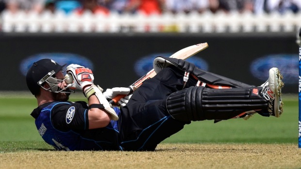 Mitchell McClenaghan of New Zealand falls to the ground after being hit by the ball above the eye during the first one-day international between New Zealand and Pakistan at the Basin Reserve in Wellington on January 25, 2016. AFP PHOTO / MARTY MELVILLE / AFP / Marty Melville (Photo credit should read MARTY MELVILLE/AFP/Getty Images)